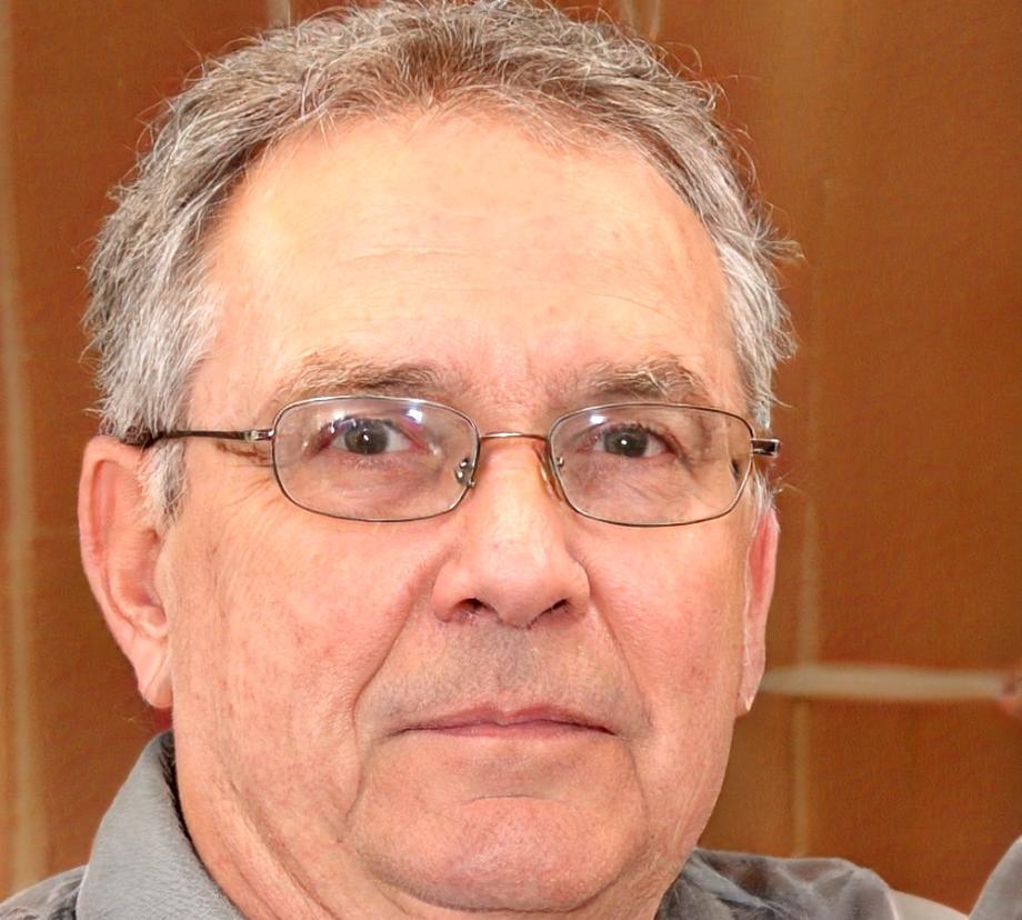Senior financial analyst reviewing business performance metrics